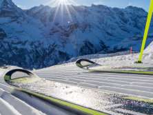 Skiers pose on the slope in Mürren-Schilthorn. The trio of the Eiger, Mönch, and Jungfrau can be seen in the distance.