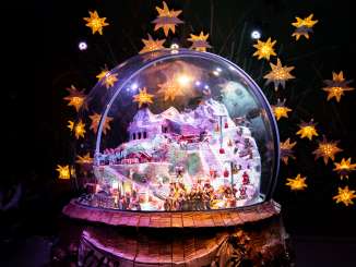 The giant snow globe in the Ice Palace on the Jungfrau Joch, surrounded by glowing stars.